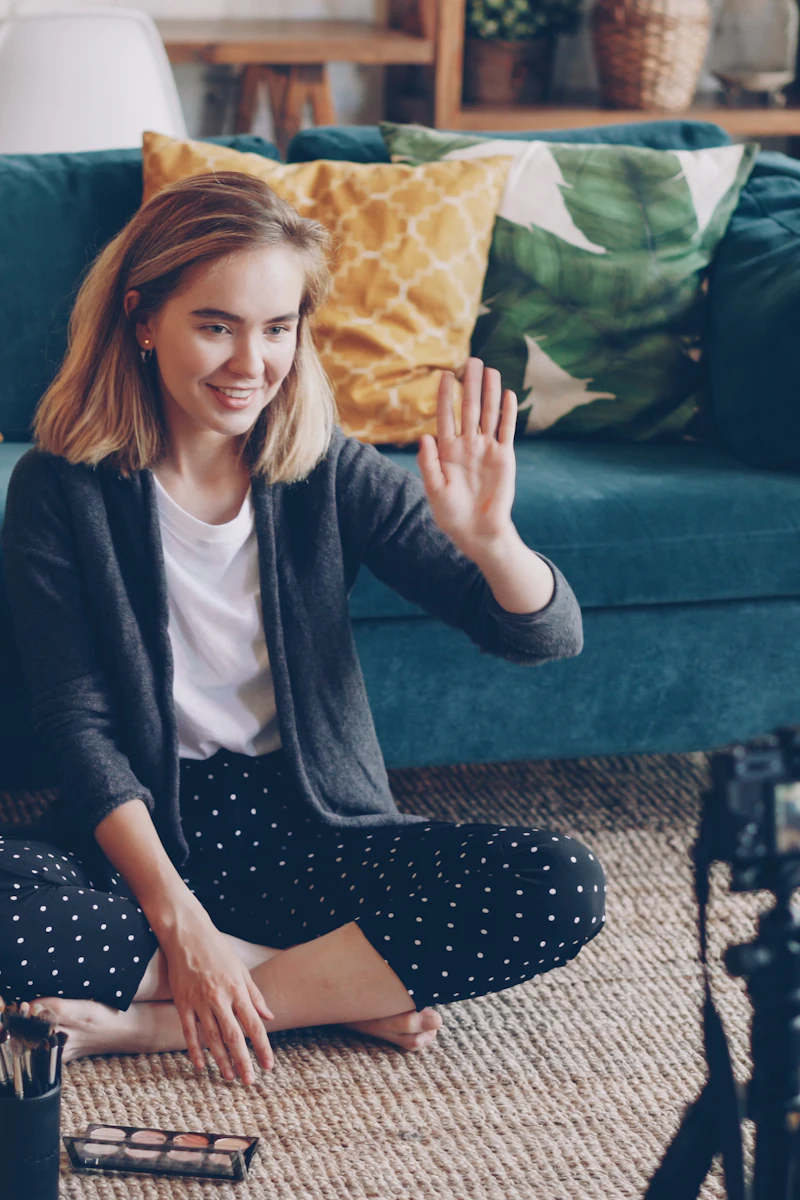 A creator filming a makeup tutorial at home.