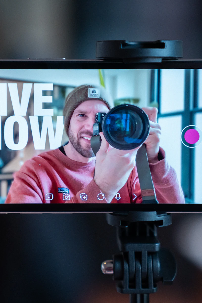 A phone mounted on a tripod, mid-livestream.